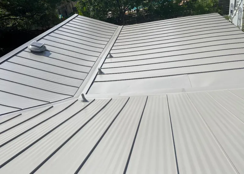 Solar attic fan installed on a metal roof for Roof Ventilation in Fort Meade